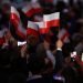 PULTUSK - Supporters of Polish President Andrzej Duda celebrate following initial election results during Poland‚Äôs Presidential elections runoff on July 12, 2020 in Pultusk, Poland. The latest polls suggest a close race between the ruling President backed by the conservative right-wing Law and Justice Party, Andrzej Duda and his opponent,Warsaw Mayor and Presidential candidate for the Civic Platform (PO), Rafal Trzaskowski. Experts predict an exact result on Monday as Polish society remains extremely divided on their choice. (Photo by Maja Hitij/Getty Images)