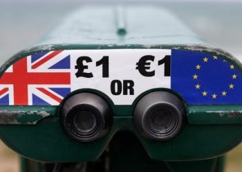 FILE PHOTO: Tourist binoculars offer users the chance to pay in Pounds or Euros in the British overseas territory of Gibraltar, historically claimed by Spain, April 20, 2017. REUTERS/Phil Noble