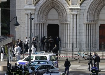 French members of the elite tactical police unit RAID enter to search the Basilica of Notre-Dame de Nice after a knife attack in Nice on October 29, 2020. - A man wielding a knife outside a church in the southern French city of Nice slit the throat of one person, leaving another dead and injured several others in an attack on Thursday morning, officials said. The suspected assailant was detained shortly afterwards, a police source said, while interior minister Gerald Darmanin said on Twitter that he had called a crisis meeting after the attack. (Photo by Valery HACHE / AFP) (Photo by VALERY HACHE/AFP via Getty Images)