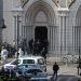 French members of the elite tactical police unit RAID enter to search the Basilica of Notre-Dame de Nice after a knife attack in Nice on October 29, 2020. - A man wielding a knife outside a church in the southern French city of Nice slit the throat of one person, leaving another dead and injured several others in an attack on Thursday morning, officials said. The suspected assailant was detained shortly afterwards, a police source said, while interior minister Gerald Darmanin said on Twitter that he had called a crisis meeting after the attack. (Photo by Valery HACHE / AFP) (Photo by VALERY HACHE/AFP via Getty Images)