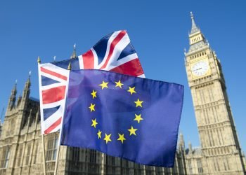 European Union and British Union Jack flag flying in front of Big Ben and the Houses of Parliament at Westminster Palace, London, in preparation for the Brexit EU referendum