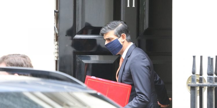 British Chancellor of the Exchequer Ridhi Sunak leaves 11 Downing Street.