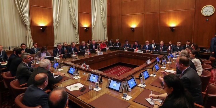 Representatives from Turkey, Russia, Iran, and other countries with stakes in the Syria conflict join United Nations Special Envoy for Syria Geir O. Pedersen at the Syrian Constitutional Committee meeting in Geneva, Switzerland,
