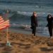 Beach goers flock to Sunset Beach despite stay at home orders due to the COVID-19 global pandemic.