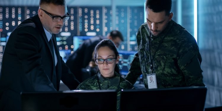Government Surveillance Agency and Military Joint Operation. Male Agent, Female and Male Military Officers Working at System Control Center.