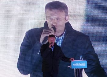 Russian politician Alexei Navalny against the background of a large screen