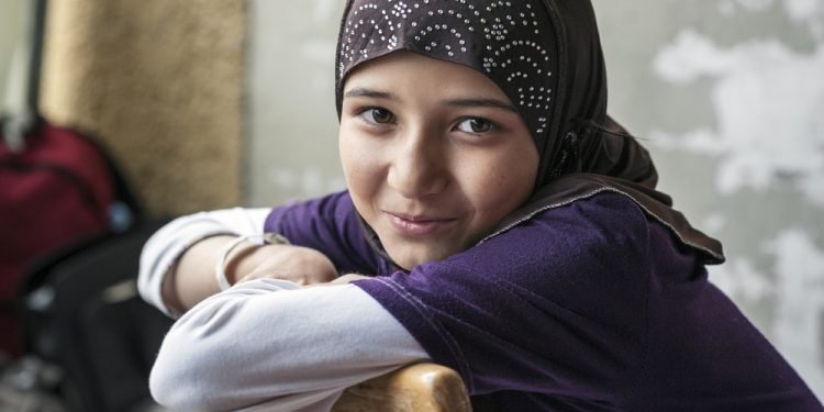 Passau, Germany - : Syrian refugee girl at a camp in Passau, Germany. The several organisations try to push them through registration fast in order to manage the critical situation