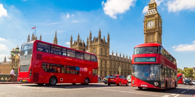 Big Ben, Westminster Bridge and red double decker bus in London, England, United Kingdom