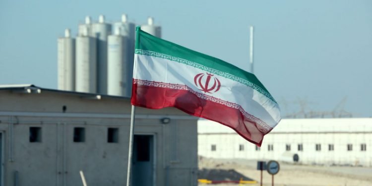 A picture taken on November 10, 2019, shows an Iranian flag in Iran's Bushehr nuclear power plant, during an official ceremony to kick-start works on a second reactor at the facility. - Bushehr is Iran's only nuclear power station and is currently running on imported fuel from Russia that is closely monitored by the UN's International Atomic Energy Agency. (Photo by ATTA KENARE / AFP) (Photo by ATTA KENARE/AFP via Getty Images)