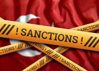 The flag of Turkey, sanctions, yellow fencing tape