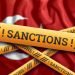 The flag of Turkey, sanctions, yellow fencing tape