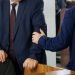 Politicians or businessmen greet each other before the start of a meeting or conference. Preparing for a decision. Head and subordinate. Patronage.