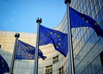 EU flags in front of European Commission in Brussels
