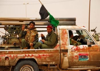 Libyan rebels travel to a battle line where they will fight Colonel Muammar Gaddafi's army. Ajdabiya, Libya, April 7, 2011