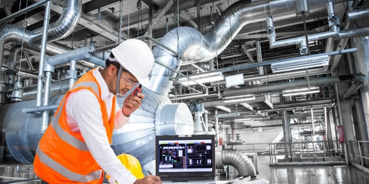 Electrical engineer working at control room of a modern thermal power plant
