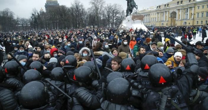 People clash with police during a protest against the jailing of opposition leader Alexei Navalny in St.Petersburg, Russia, Saturday, Jan. 23, 2021.