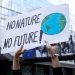 Brussels, Belgium. 8th Sep. 2018.Activists hold placards and chant slogans during a demonstration to demand immediate an action on climate change in front of European Parliament.