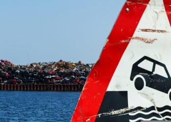 Scrap pieces and cars car wrecks at the port for export dumping, disposal illegal danger