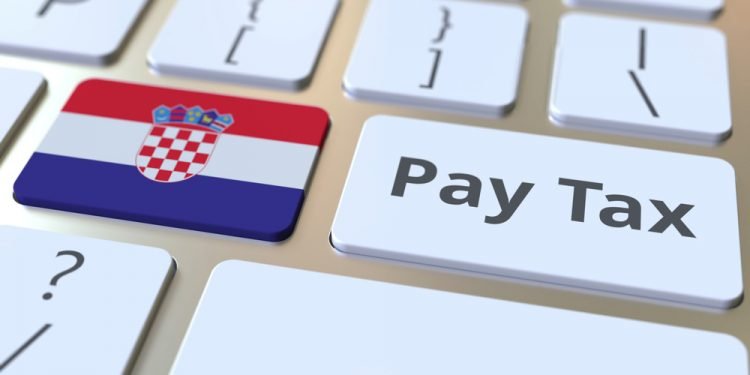 PAY TAX text and flag of Croatia on the buttons on the computer keyboard.