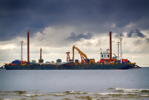 Construction of offshore section of gas pipeline on bottom of Baltic sea Nord stream-2. Auxiliary vessels at sea. Draghi's (dredging vessel) work on deepening sea Bay. Shallow water trenching barge