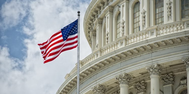 Washington DC Capitol dome detail with waving american flag