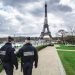 Paris, France - March 18, 2012: Patrols of two police officers in the Trocadero gardens and Eiffel Tower.