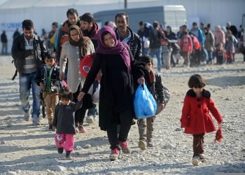 Bogorodica, Gevgelija, Macedonia, August 21 2015: Refugees and migrants are moving towards the railway station in Gevgelija.