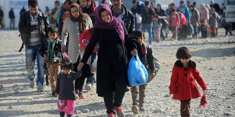 Bogorodica, Gevgelija, Macedonia, August 21 2015: Refugees and migrants are moving towards the railway station in Gevgelija.