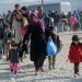 Bogorodica, Gevgelija, Macedonia, August 21 2015: Refugees and migrants are moving towards the railway station in Gevgelija.