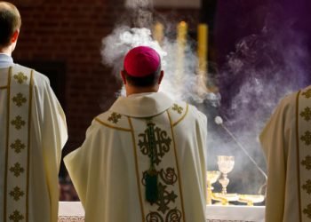 Torun Poland - April 18, 2019: Bishop censes incense during Chrism Mass in the Cathedral Church of St. John the Baptist and St. John the Evangelist