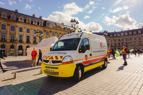 Paris, France - Oct. 2020 - A Renault Master medical ambulance and emergency vehicle of the first-aid unit of the Ordre de Malte (Order of Malta), a French catholic charity, in Place Vendôme Square