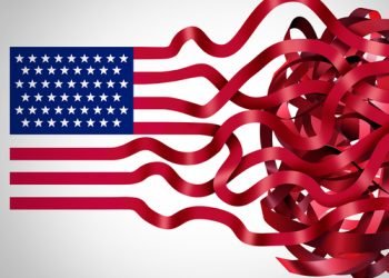 Government red tape concept and American bureaucracy symbol as an icon of the flag of the United States with the red stripes getting tangled in confusion as a metaphor for political inefficiency.