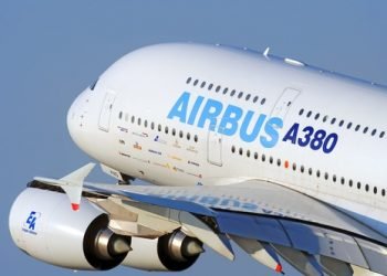 DUBAI, UAE - CIRCA NOVEMBER, 2009: Airbus Industries EADS Airbus A380 super jumbo large wide body passenger airplane take off detail aerial exterior close up crop view