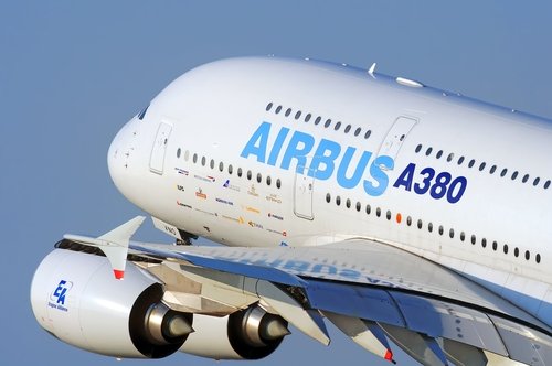 DUBAI, UAE - CIRCA NOVEMBER, 2009: Airbus Industries EADS Airbus A380 super jumbo large wide body passenger airplane take off detail aerial exterior close up crop view