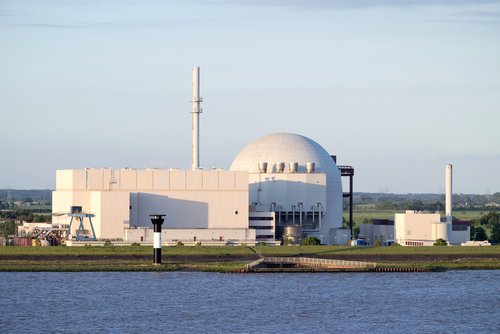 BROKDORF, GERMANY - June 4, 2017: Riverside view of Brokdorf Nuclear Power Plant. It started in October 1986 and the decommissioning is planned for 2021.