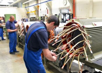 Workers,In,A,Factory,Assemble,Electric,Motors,(berlin,berlin/germany,24.05.2013)