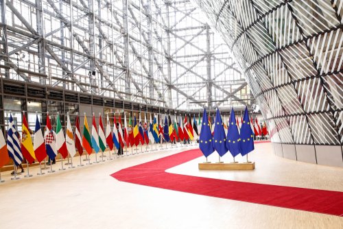 Brussels, Belgium – June 21, 2019: European Union flags swing in Europa building in Brussels.