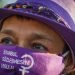 A woman wearing protective masks with a sign reading: "Implement Istanbul Convention!", take part in a protest against femicide and domestic violence, in Istanbul, Turkey August 5, 2020