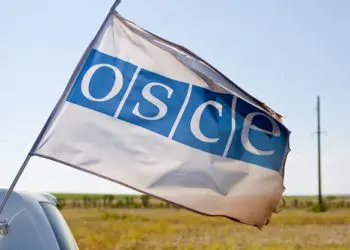 AUGUST 2, 2015: OSCE (Organisation for Security and Cooperation in Europe) passing with flag mounted on the vehicle.