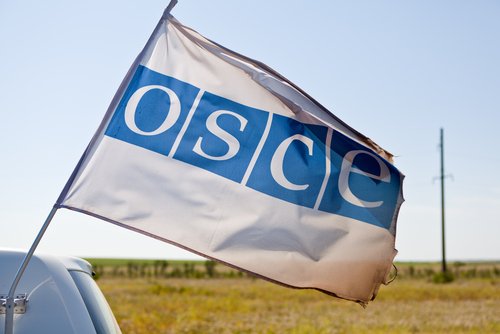 AUGUST 2, 2015: OSCE (Organisation for Security and Cooperation in Europe) passing with flag mounted on the vehicle.