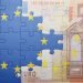 Puzzle with the national flag of european union and euro banknote