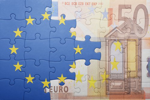 Puzzle with the national flag of european union and euro banknote