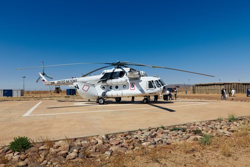 Mali, Goundam - January 30, 2017: UN helicopter unloading at Goundam helipad in dangerous Timbuktu region at United Nation peacekeeping mission in Western Africa.