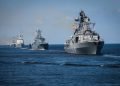 A line ahead of modern russian military naval battleships warships in the row, northern fleet and baltic sea fleet, summer sunny day