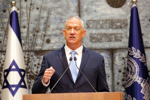Israeli President Reuven Rivlin (R) presents Blue and White party leader Benny Gantz with the mandate to form a new Israeli government at the President's residence in Jerusalem, on Oct. 23, 2019.