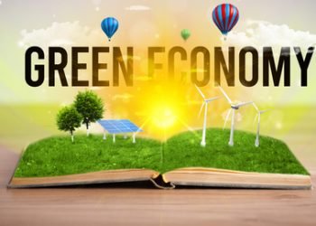 Open book with GREEN ECONOMY inscription, renewable energy concept