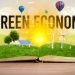 Open book with GREEN ECONOMY inscription, renewable energy concept