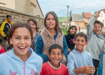 05-16-2018. Lomnicka, Slovakia. A close-up of a Roma or Gypsy group of children smiling in an abandoned community in the heart of Slovakia, living in miserable conditions.