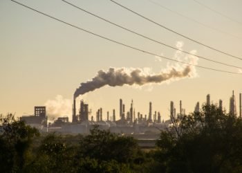 Oil refineries polluting carbon and cancer causing smoke stacks climate change and power plants in Corpus Christi , Texas a massive large refinery
