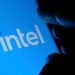 Stone UK - September 2 2020: New Intel logo seen on the screen and blurred fingertip touching it in a dark. Intel presented its rebranded logotype on September 2nd 2020. Selective focus.